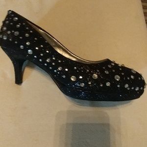 New in box, never worn 21/2" heel.  Size 7.5